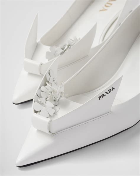 White Brushed Leather Pumps With Floral Appliqués 